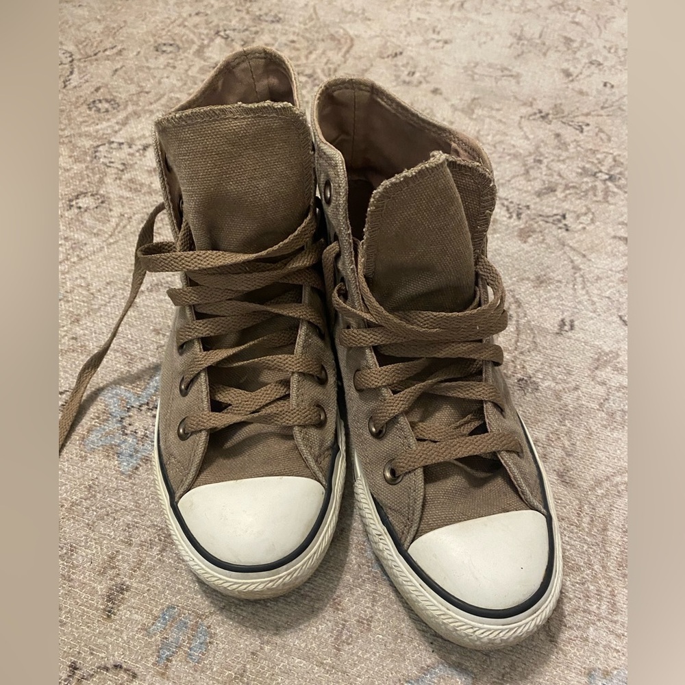 Brown converse high tops.
